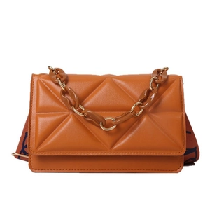 Caramel quilted geometric flap bag with resin chain and patterned wide fabric strap