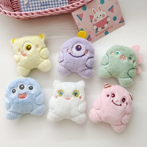 Set of six colorful plush monster dolls featuring detailed embroidery and soft fur texture