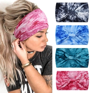 Close-up of elastic tie-dye yoga headbands featuring wide twist design and sweat-wicking fabric