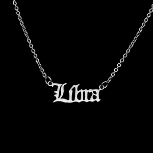 Detailed close-up of Libra zodiac pendant in Gothic font on stainless steel chain