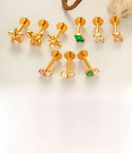 Detailed view of titanium flat back studs with star and geometric zircon inlays