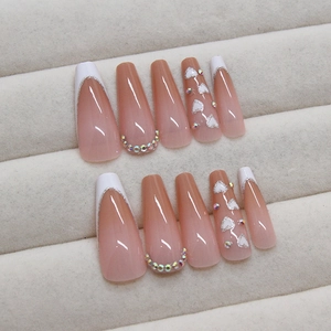Long coffin press-on nails with pink base, white French tips, rhinestones and glitter hearts