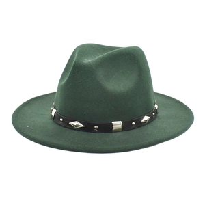 Close-up of dark green wool fedora hat featuring silver diamond studs on a black band