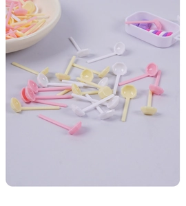 Detailed macro view of colorful miniature plastic spoons for dollhouse kitchen DIY crafts