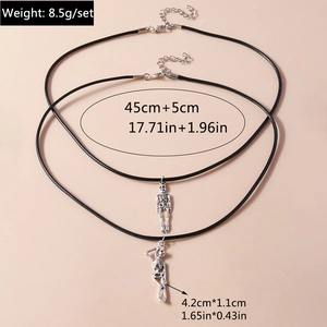 Detail view of silver skull pendants on black cords with size and weight dimensions