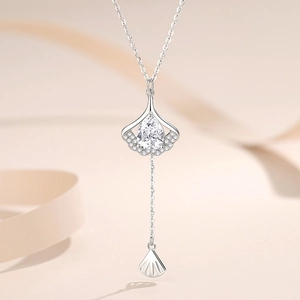 Elegant S925 sterling silver ginkgo leaf necklace with tassel and zircon pear-cut stones