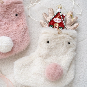 Pink plush reindeer Christmas gift bag with white faux fur ears and candy house accessory