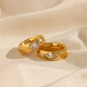 Detail of 18K gold plated stainless steel rings with square and marquise cubic zirconia