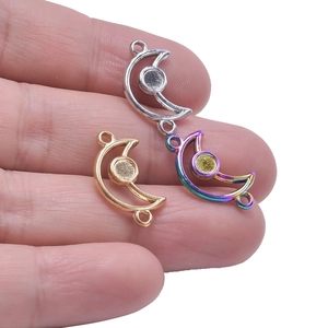 Three crescent moon necklace connectors in gold, silver, and rainbow steel finish