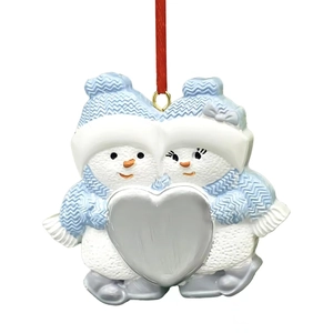 Detail of resin snowman couple ornament with blue hats and silver heart centerpiece