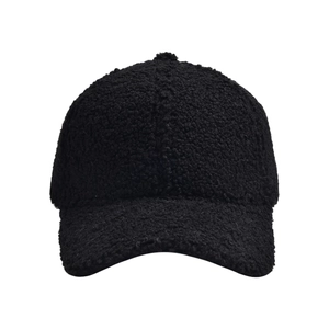 Close-up detail of warm black lamb wool baseball cap texture with thick fleece fabric