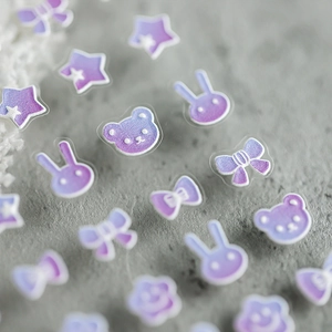 3D pearlescent gradient nail stickers with cute bear and rabbit shapes on stone background