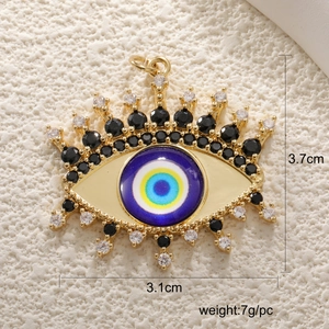 Macro view of gold evil eye pendant with 3.7cm height and zircon inlay details