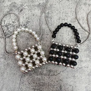 Mini handmade beaded handbag with silver metallic beads and white pearls in grid pattern
