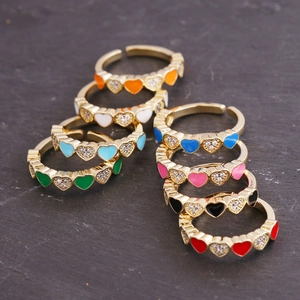 Collection of colorful enamel heart rings with cubic zirconia pavé in gold finish