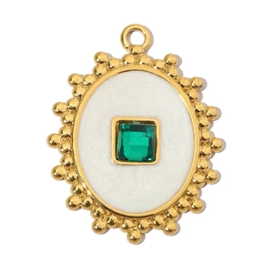 Detailed view of eagle-style pendant with green gemstone and white enamel finish
