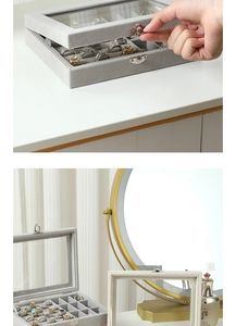 Detail of silver metal buckle and soft grey velvet lining in jewelry storage box