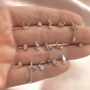 Detailed macro view of starry moon zircon earrings set with blue crystal tassels