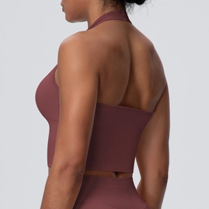 Detail view of the halter neck design and breathable fabric on the agate red yoga top