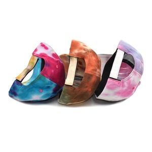 Tie-dye baseball caps in various colors with adjustable hook and loop back closure