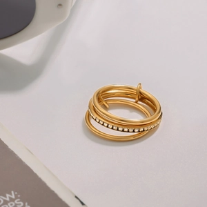 Stacked gold stainless steel ring with micro-paved cubic zirconia for a luxury layered look