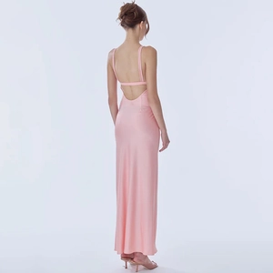 Detail of pink backless maxi dress showing slim straps and smooth silky fabric