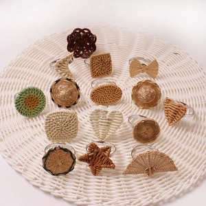 Variety of handmade woven rattan napkin rings in heart, star and circular shapes