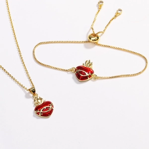 Gold jewelry set with red heart enamel necklace and adjustable slider bracelet