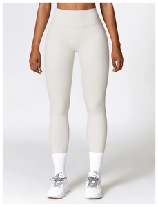 Detail of high waisted seamless yoga leggings in beige showing tummy control waistband
