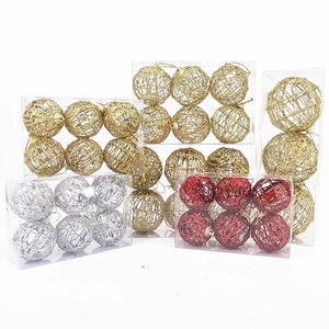 Detail of glittered hollow wire Christmas balls in gold silver and red sets