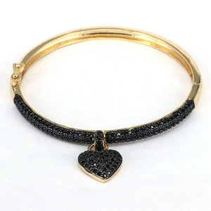 Adjustable gold plated hinged bangle with black pavé heart pendant and crystals