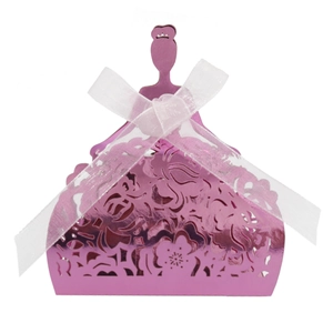 Detail of pink princess dress candy box with laser-cut floral patterns and white bow