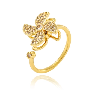 Golden rotatable windmill open ring featuring clear zircon stones and a polished finish