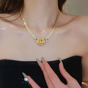 Vintage gold oval necklace featuring yellow gemstone and pavé diamonds for women