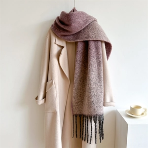 Extra long thick pink purple gradient scarf with fringes draped on a beige coat