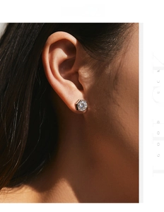 Macro side view of a 1ct Moissanite stud earring in a hexagonal S925 silver setting