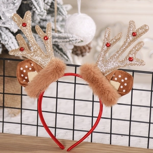 Detail of glittery gold reindeer antlers with soft brown faux fur on festive headband