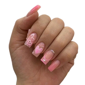 Pink heart-themed press-on nails with glitter accents and rhinestones on square shape