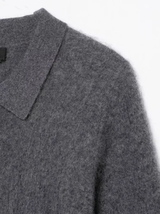 Close-up of dark grey knitted POLO shirt showing fuzzy wool texture and collar detail