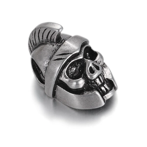 Detail of silver skull knight charm with helmet and zircon teeth for jewelry making