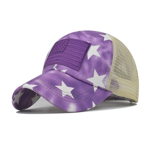 Detail of purple star pattern baseball cap with American flag patch and mesh back