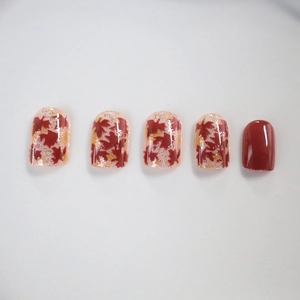 Short square press-on nails with autumn maple leaf hand-painted design and gold glitter