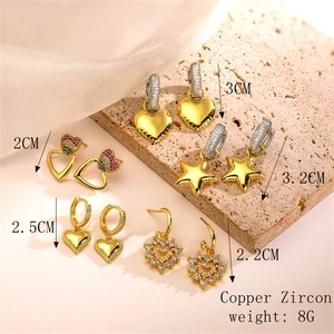Detailed view of five-piece gold copper earring set with stars, hearts, and zircons