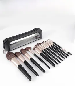 Detailed set of 11 professional makeup brushes with brown bristles and a black storage bag