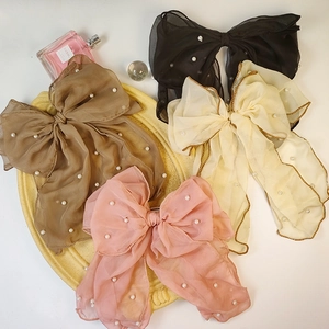 Elegant chiffon bow hair clips set with pearls and gold trim in four soft pastel colors