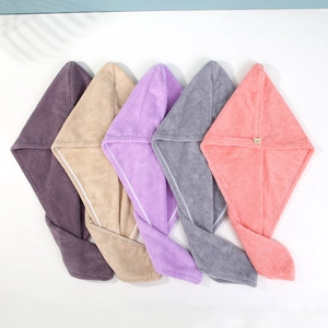 Close-up of colorful thickened coral fleece hair drying towels in various soft shades