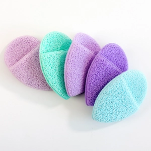 Five heart-shaped konjac face sponges in purple and turquoise on a white background