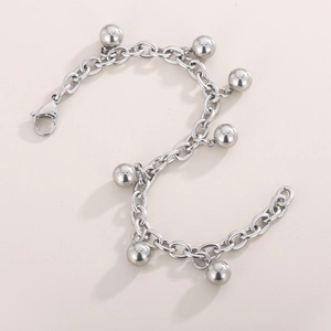 Detailed macro view of silver stainless steel ball chain bracelet with lobster clasp