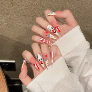 Lange Stiletto Kunstnägel mit Zirkus-Clown-Thema und rot-weißen Streifen für Frauen