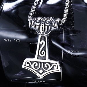 Macro shot of stainless steel Thor Mjölnir pendant with precise size measurements